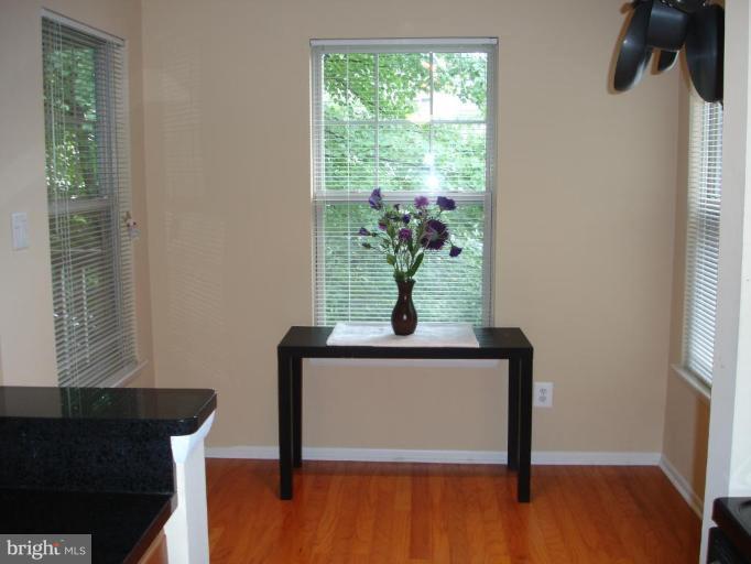11655 Gas Light Court, Unit 11655C Reston, VA 20190 - Photo 3 of 9 a view of entryway with wooden floor