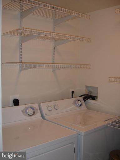 11655 Gas Light Court, Unit 11655C Reston, VA 20190 - Photo 8 of 9 a bathroom with a sink and vanity