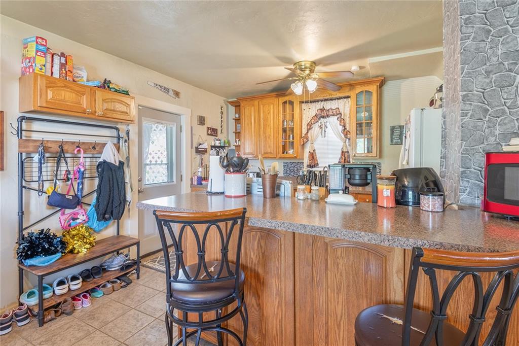 2913 Willett Road Pittsburgh, PA 15227 - Photo 12 of 25 a view of a dining room with furniture one side kitchen view and wooden floor