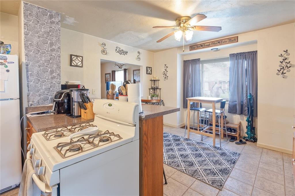2913 Willett Road Pittsburgh, PA 15227 - Photo 14 of 25 a kitchen with a dining table and chairs