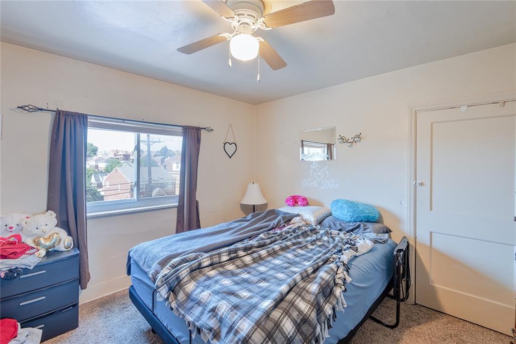 2913 Willett Road Pittsburgh, PA 15227 - Photo 16 of 25 a bedroom with a bed and a chandelier