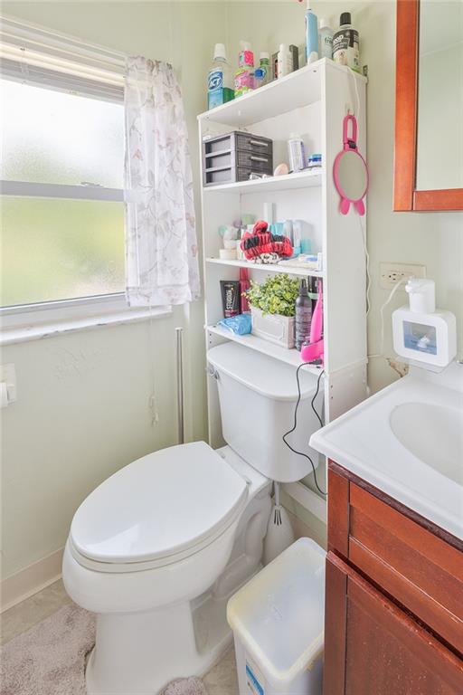 2913 Willett Road Pittsburgh, PA 15227 - Photo 18 of 25 a bathroom with a sink a toilet and a window