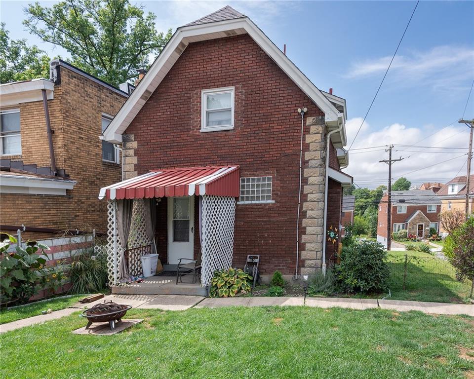 2913 Willett Road Pittsburgh, PA 15227 - Photo 4 of 25 a view of a house with a yard plants and a large tree