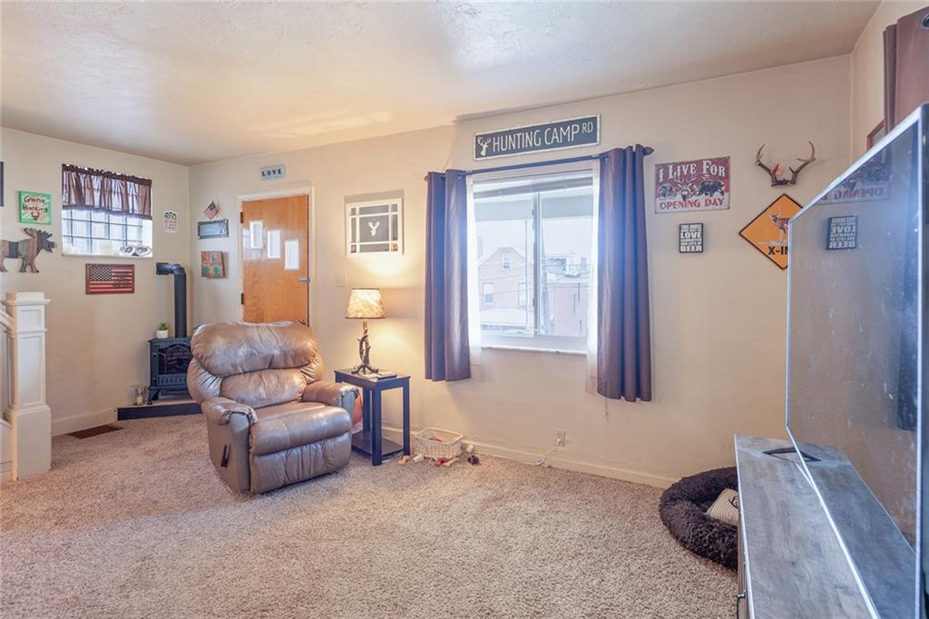 2913 Willett Road Pittsburgh, PA 15227 - Photo 10 of 25 a living room with furniture and a window