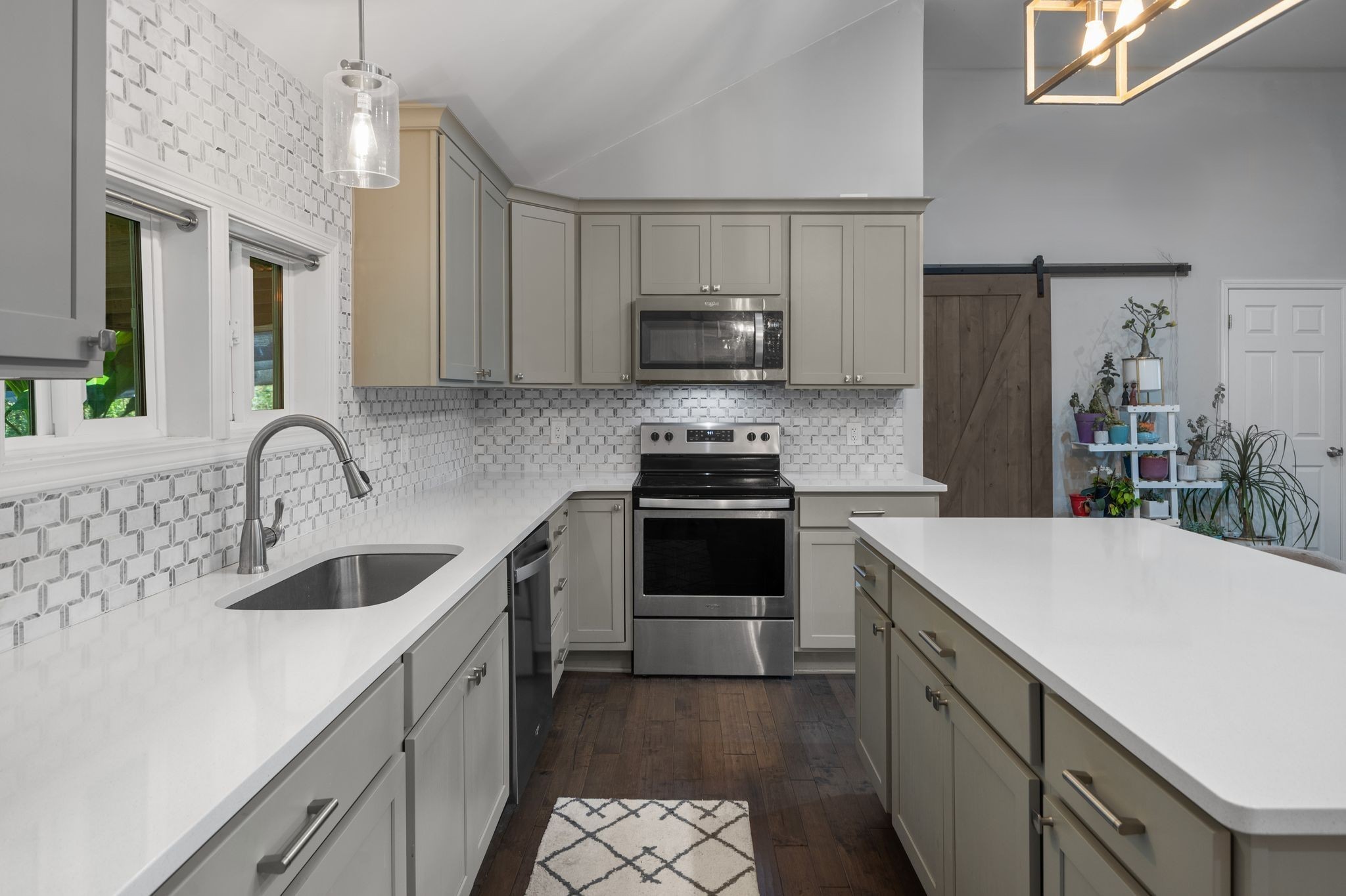 10209 New Hope Road Bon Aqua, TN 37025 - Photo 6 of 22 a kitchen with a sink cabinets and stainless steel appliances
