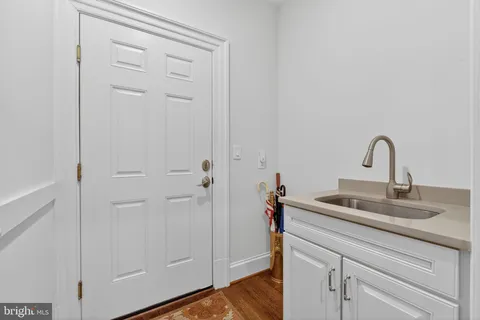 a bathroom with a sink a vanity and a mirror