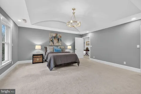 a bedroom with a bed and a cabinets
