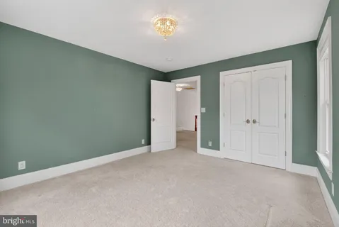 a view of a porch with furniture and garden