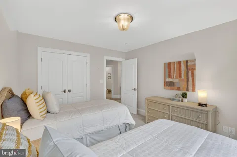 a view of a dining room with furniture wooden floor and a chandelier