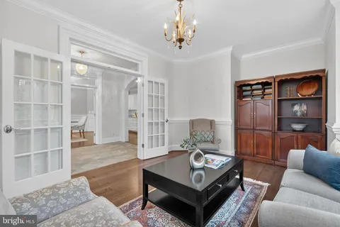 a kitchen with stainless steel appliances granite countertop a sink a stove and a wooden floors