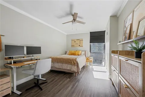 a bedroom with a bed and a desk