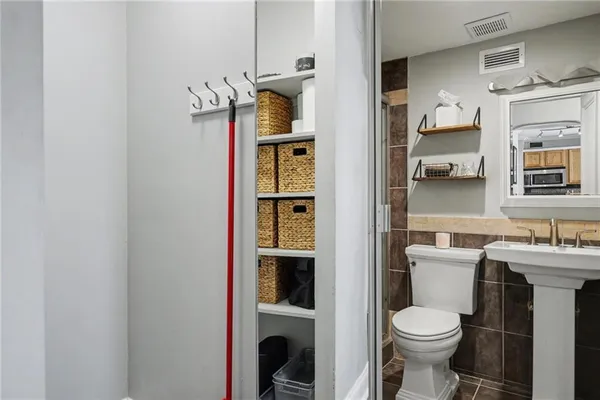 a bathroom with a toilet and a sink