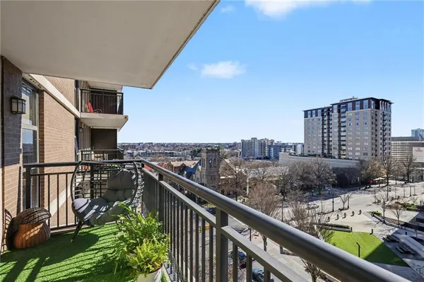 a view of a balcony with city view