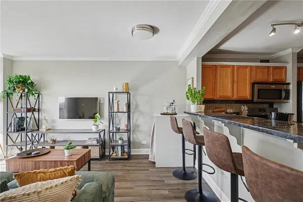a living room with furniture and a flat screen tv