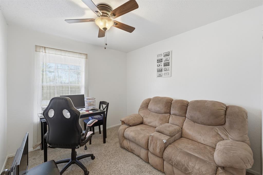 346 Meridian Street Gladewater, TX 75647 - Photo 11 of 28 a work room with furniture and a window