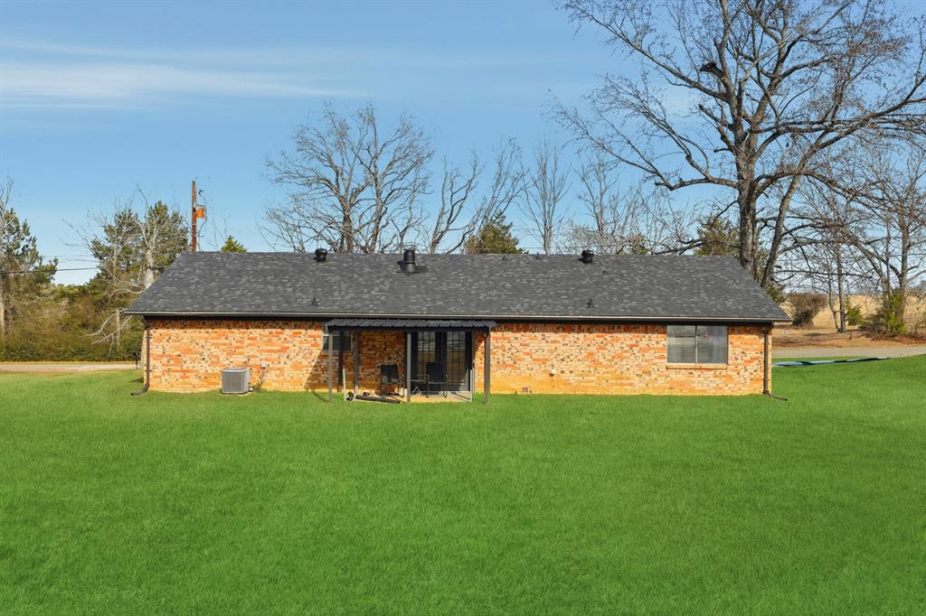 346 Meridian Street Gladewater, TX 75647 - Photo 21 of 28 a house view with a garden space