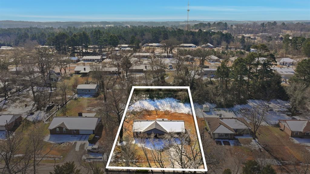 346 Meridian Street Gladewater, TX 75647 - Photo 27 of 28 an aerial view of a house with a yard