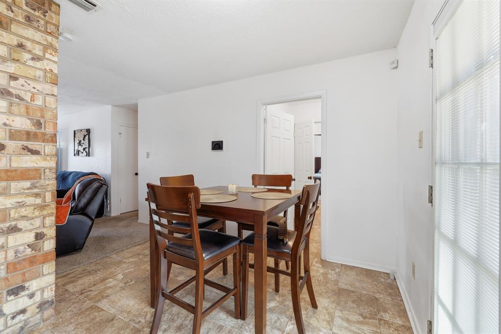 346 Meridian Street Gladewater, TX 75647 - Photo 7 of 28 a view of a dining room with furniture and a window
