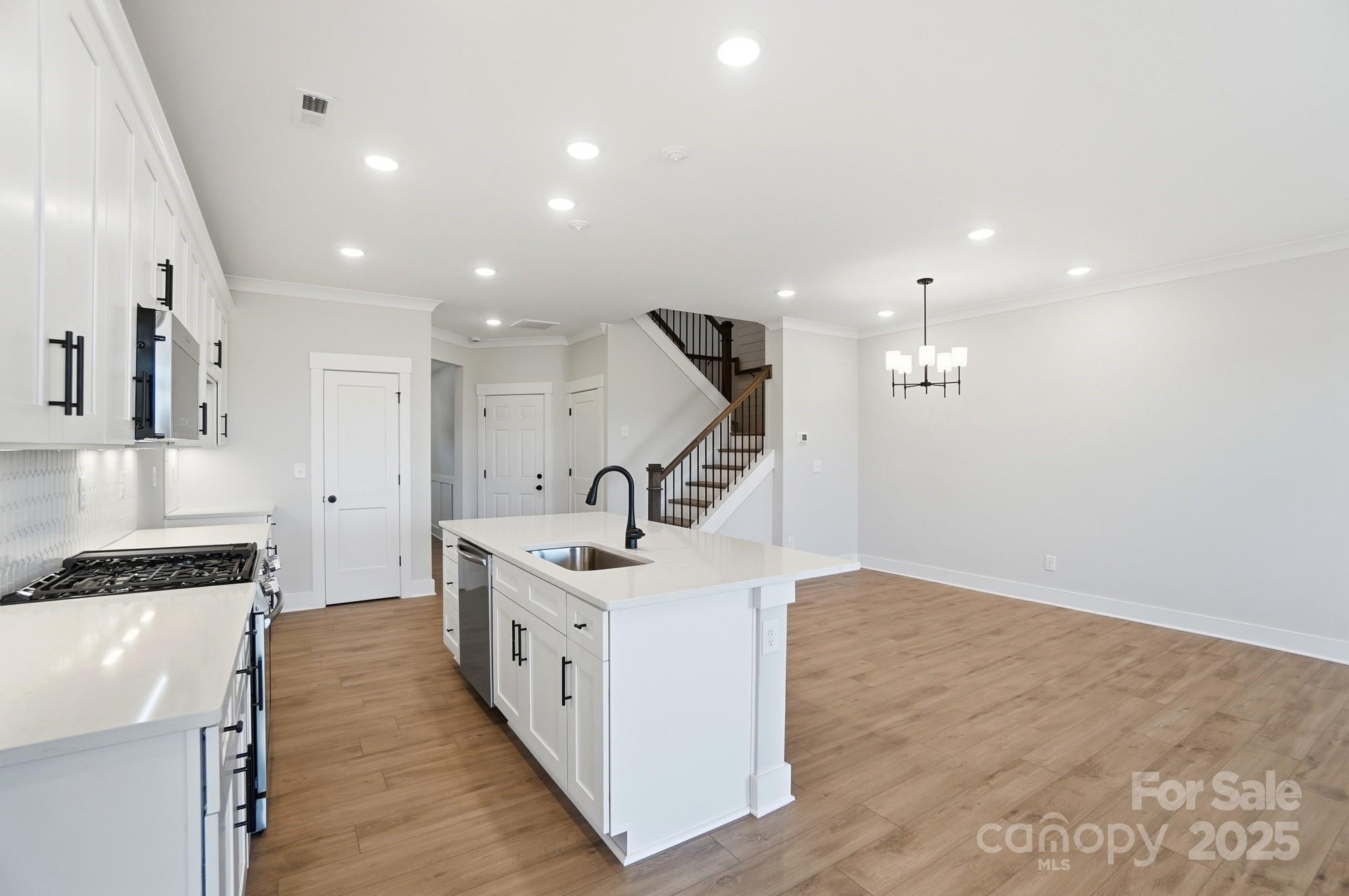 406 Limelight Road Waxhaw, NC 28173 - Photo 14 of 48 a kitchen with counter top space cabinets and appliances