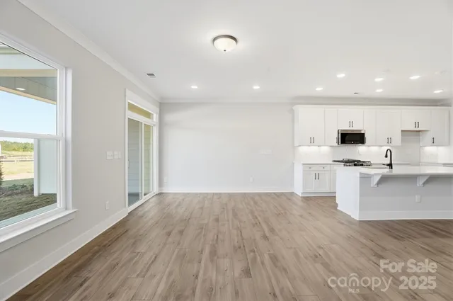 a view of kitchen with wooden floor