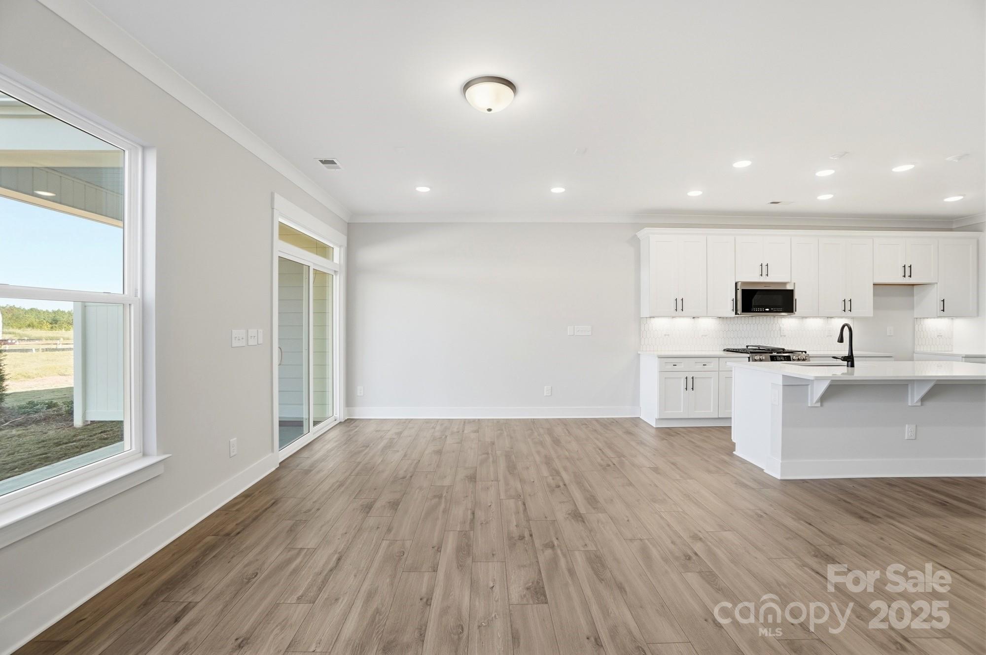 406 Limelight Road Waxhaw, NC 28173 - Photo 23 of 48 a view of kitchen with wooden floor