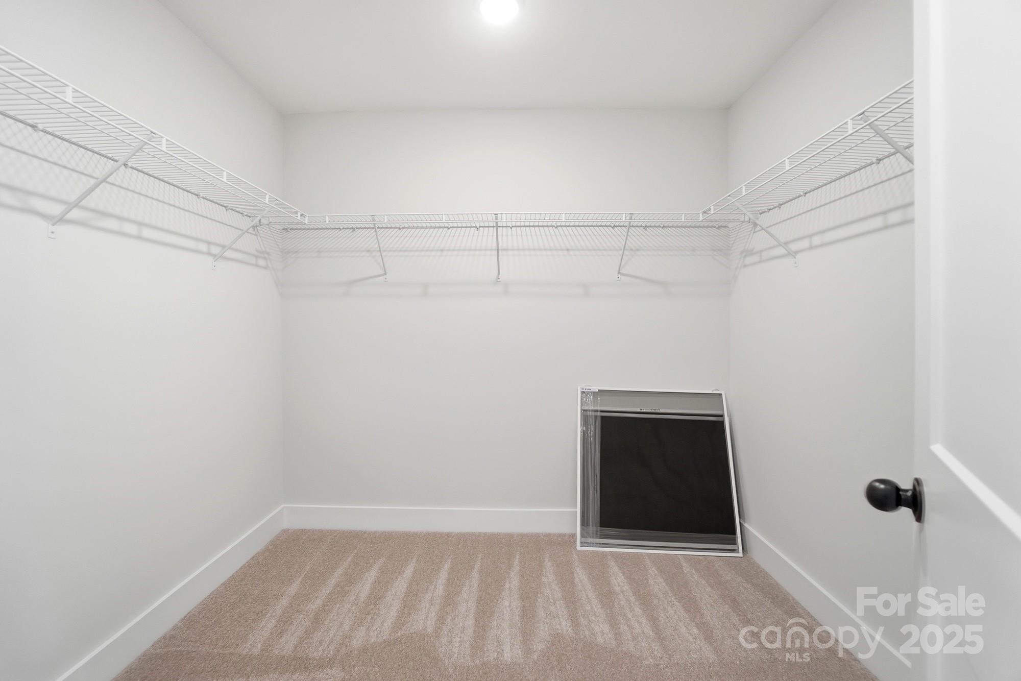 406 Limelight Road Waxhaw, NC 28173 - Photo 35 of 48 a view of a room with an empty space