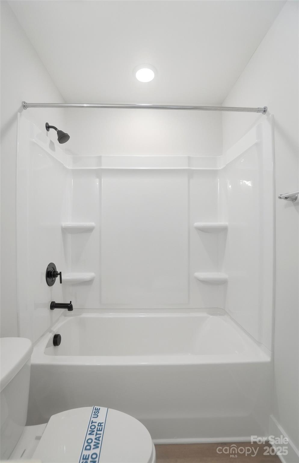 406 Limelight Road Waxhaw, NC 28173 - Photo 39 of 48 a bathroom with a bathtub and a toilet