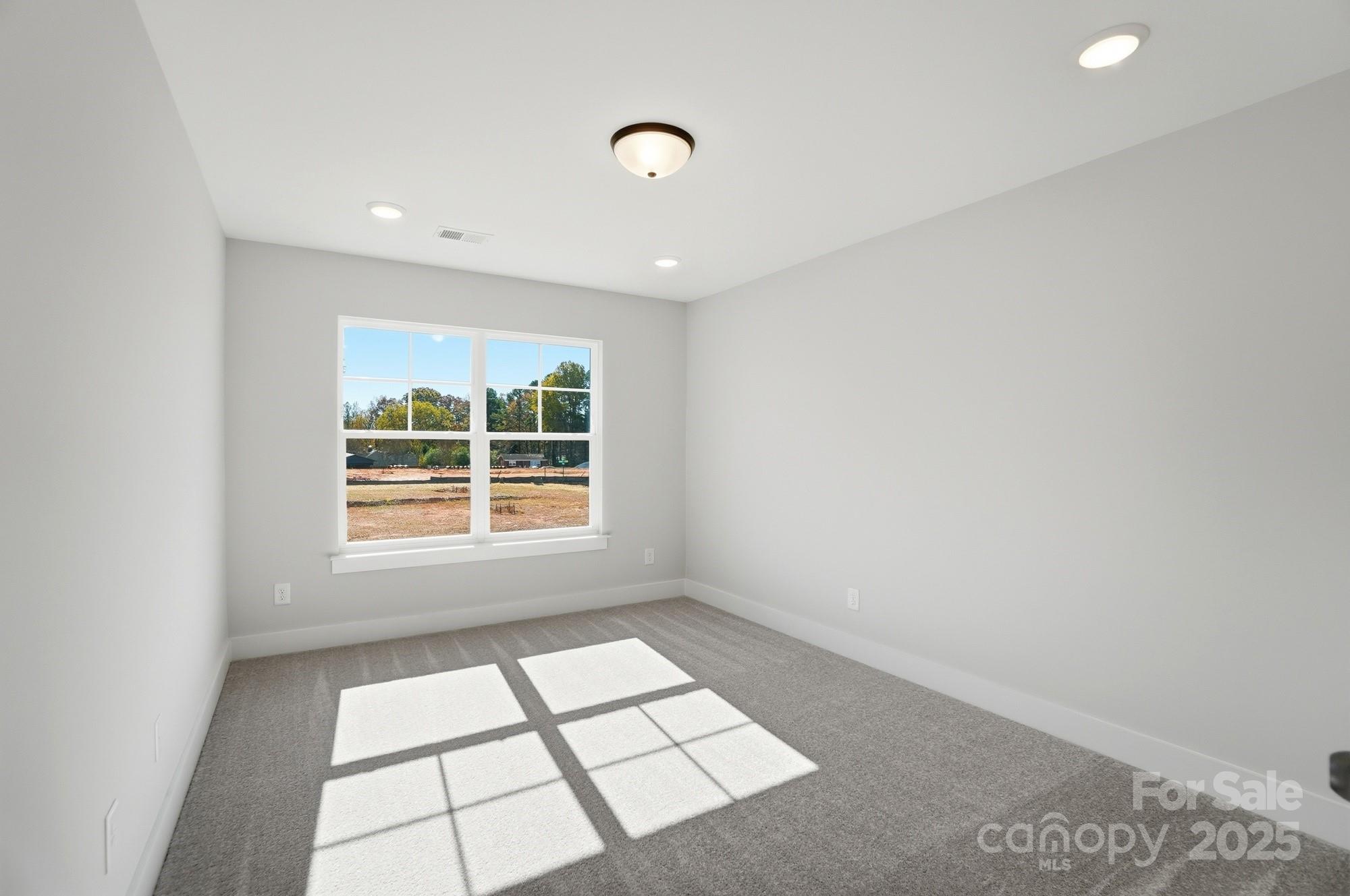 406 Limelight Road Waxhaw, NC 28173 - Photo 40 of 48 a view of an empty room and window