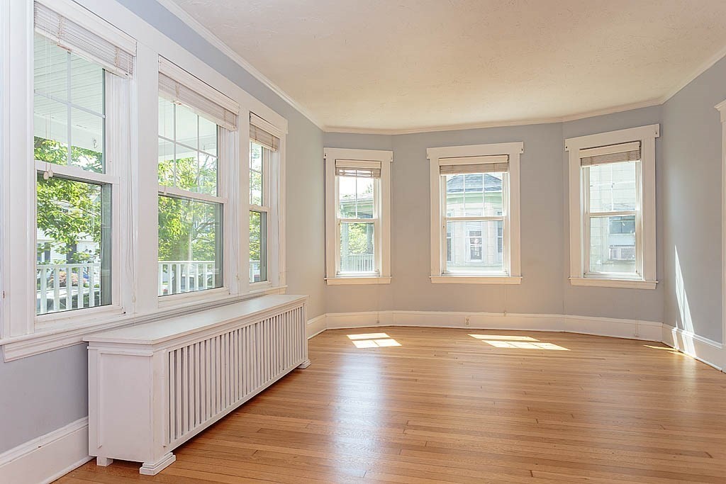 37 Huntington Road Milton, MA 02186 - Photo 12 of 35 a view of an empty room with wooden floor and a window