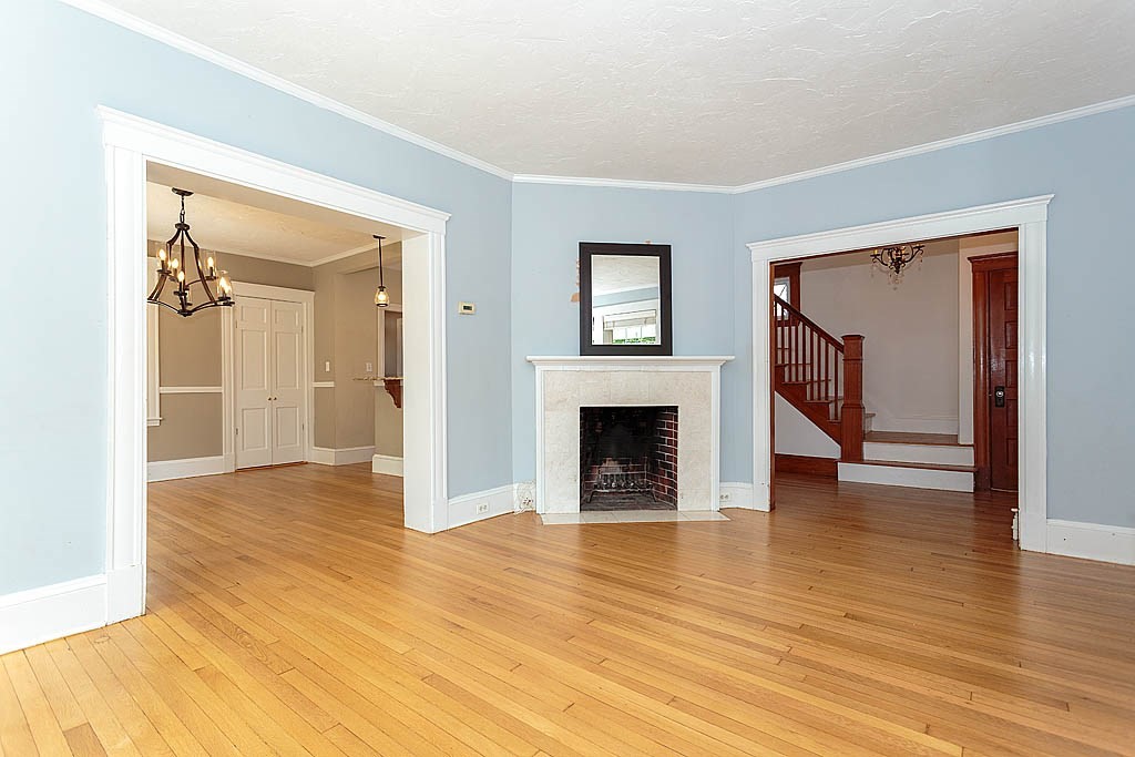 37 Huntington Road Milton, MA 02186 - Photo 13 of 35 a view of a livingroom with wooden floor and a fireplace