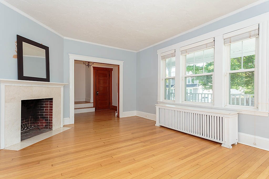 37 Huntington Road Milton, MA 02186 - Photo 14 of 35 a view of an empty room with wooden floor and a window