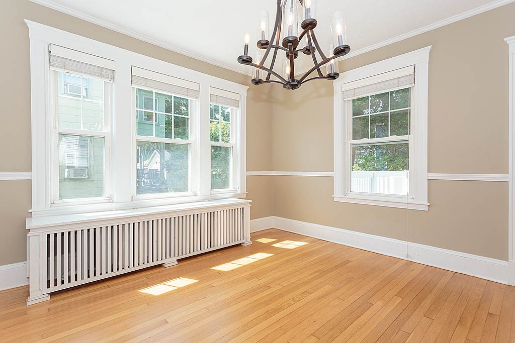 37 Huntington Road Milton, MA 02186 - Photo 15 of 35 a view of an empty room with wooden floor and a window
