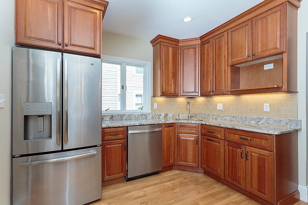 37 Huntington Road Milton, MA 02186 - Photo 17 of 35 a kitchen with stainless steel appliances granite countertop a refrigerator and a sink