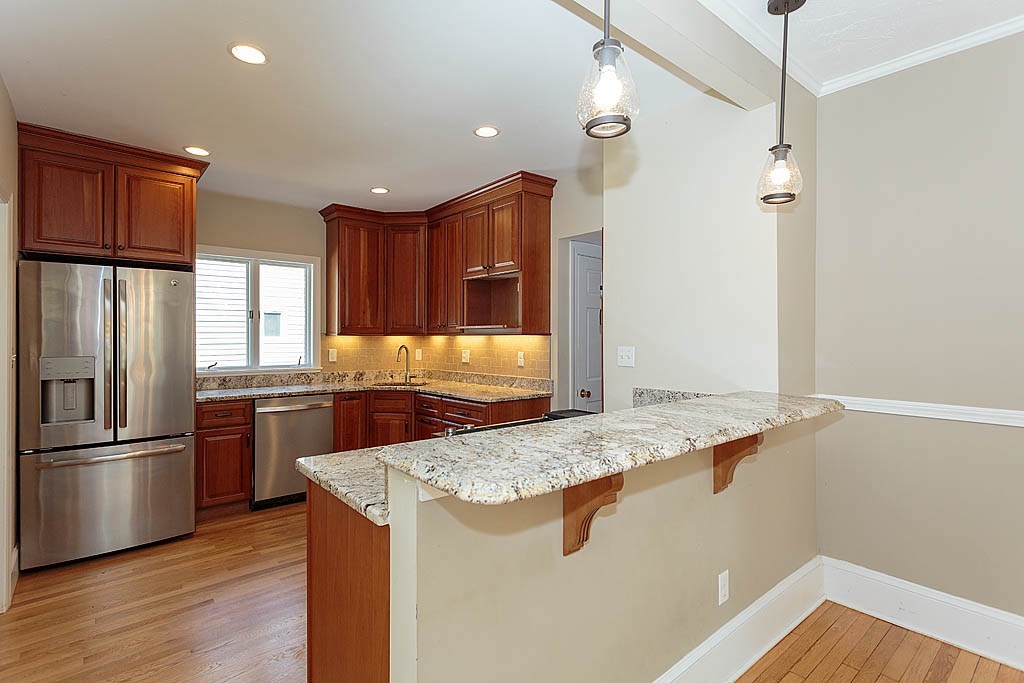 37 Huntington Road Milton, MA 02186 - Photo 18 of 35 a kitchen with stainless steel appliances granite countertop a refrigerator a sink and a stove