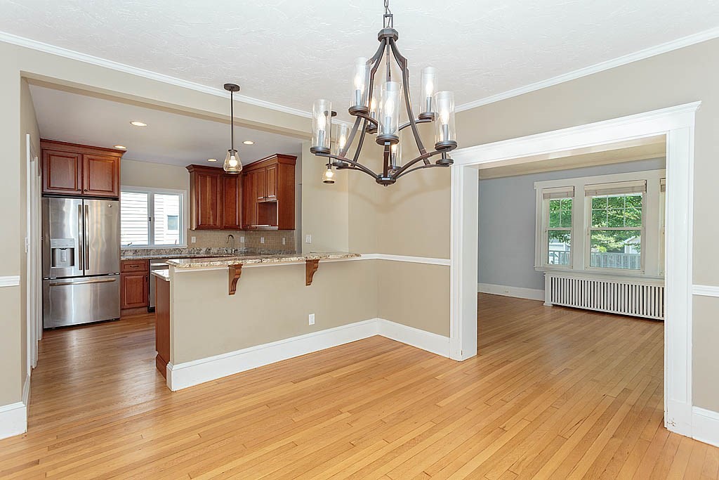 37 Huntington Road Milton, MA 02186 - Photo 19 of 35 a view of a kitchen with wooden floor and a window