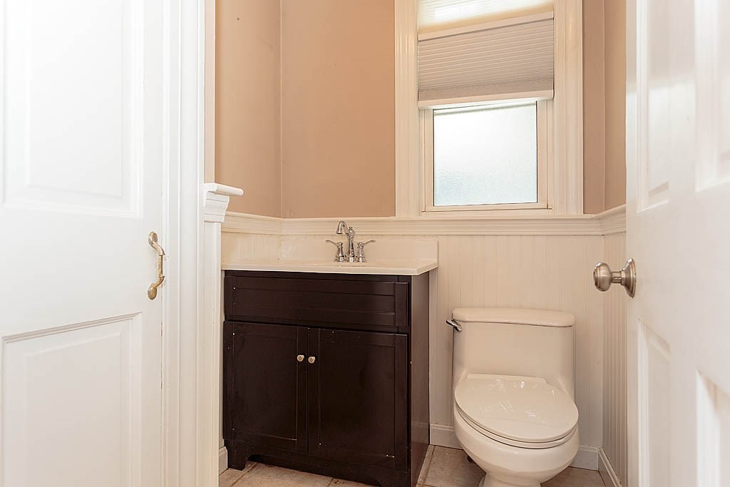 37 Huntington Road Milton, MA 02186 - Photo 21 of 35 a bathroom with a toilet a sink and mirror