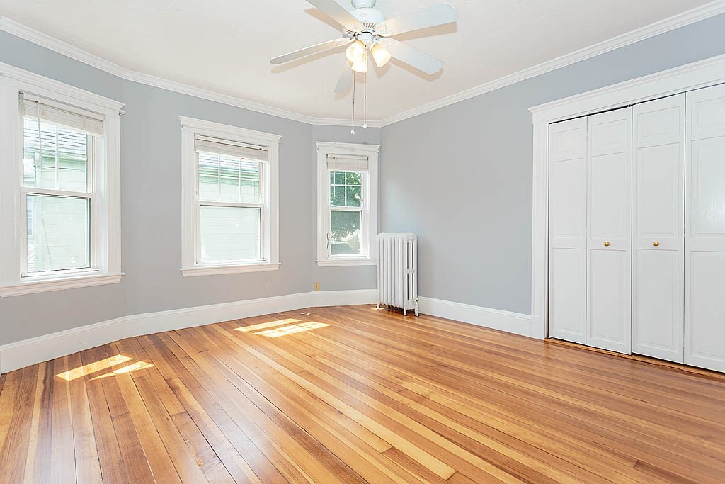 37 Huntington Road Milton, MA 02186 - Photo 29 of 35 a view of an empty room with wooden floor and a window