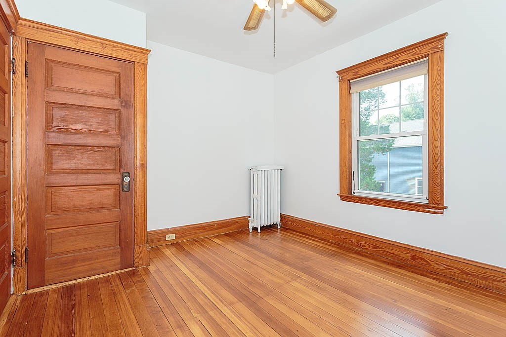 37 Huntington Road Milton, MA 02186 - Photo 31 of 35 an empty room with wooden floor closet and windows
