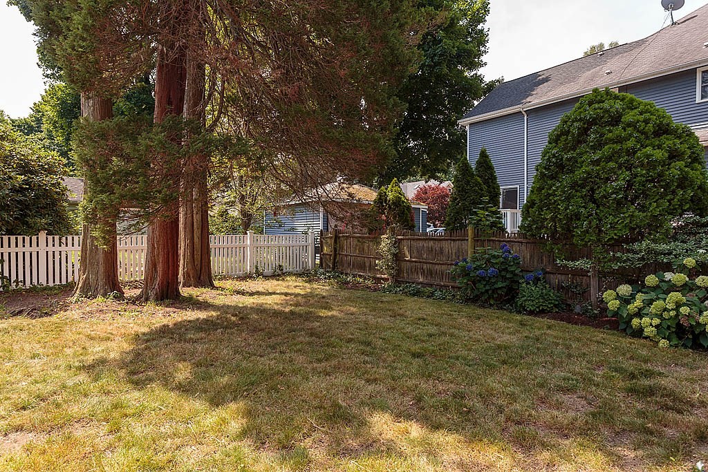 37 Huntington Road Milton, MA 02186 - Photo 10 of 35 a backyard of a house with lots of green space