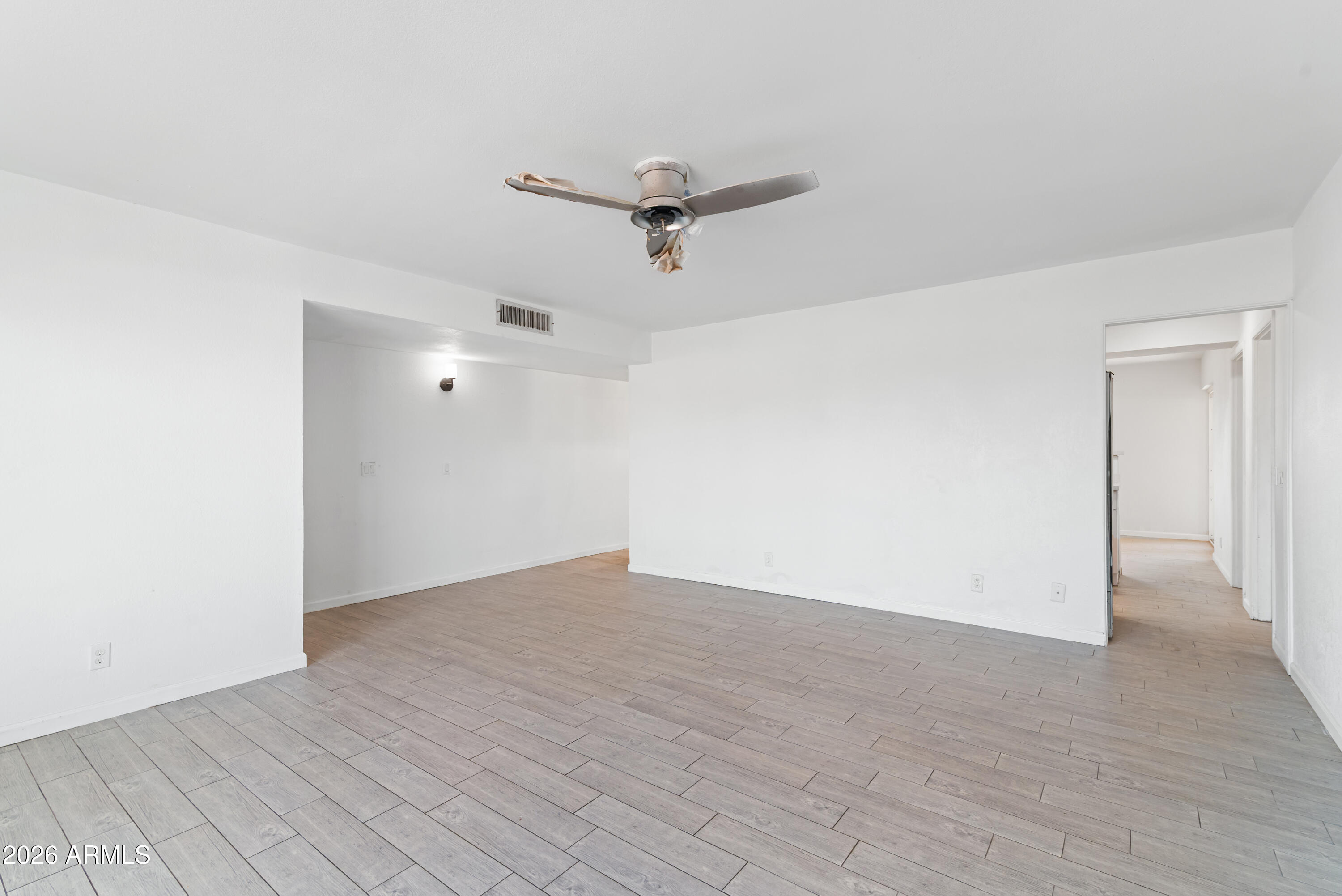 860 West McLellan Road Mesa, AZ 85201 - Photo 12 of 26 an empty room with a ceiling fan and window