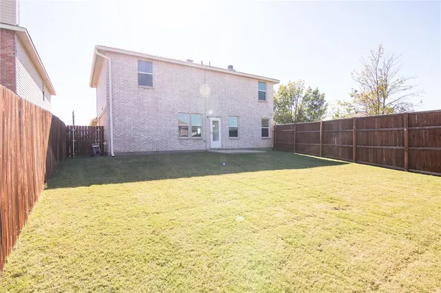 a view of a swimming pool with a backyard