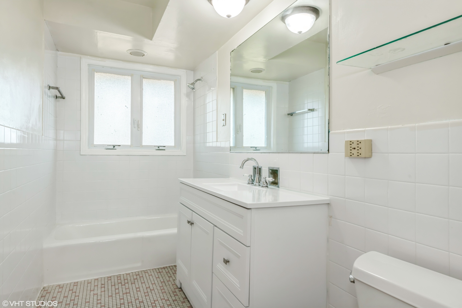 768 Concord Lane, Unit 768 Barrington, IL 60010 - Photo 9 of 12 a bathroom with a sink a toilet and a bathtub