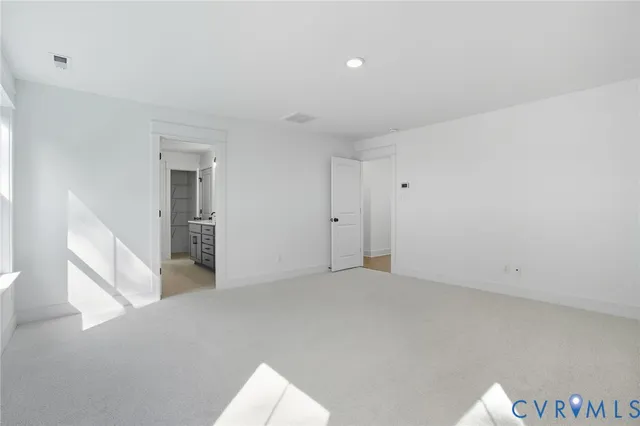 a bathroom with a double vanity sink a mirror and a shower