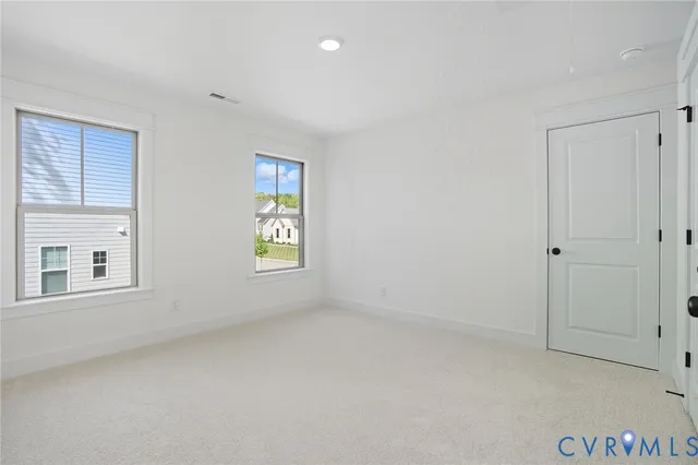 a view of an empty room and window