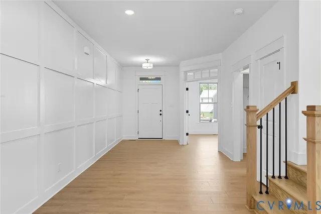a view of entryway with wooden floor