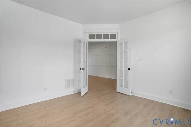 a view of a kitchen with a sink and a refrigerator