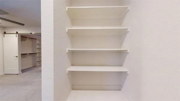 a view of an empty walk in closet