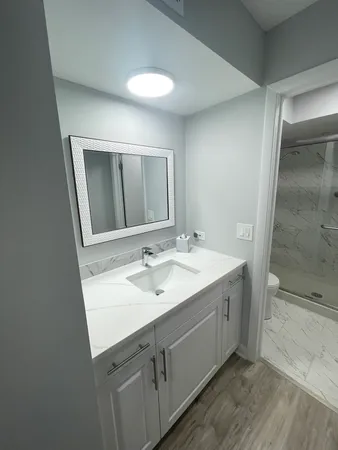 a view of hallway with wooden floor