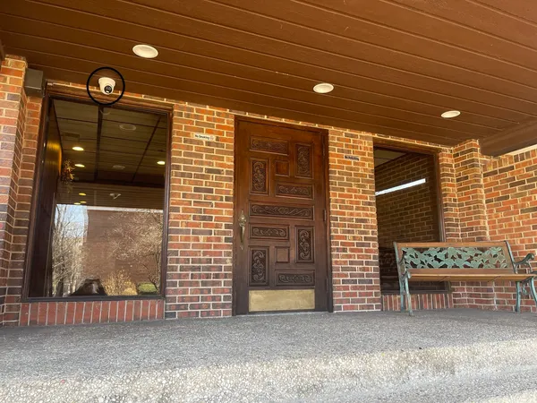 a view of a porch with a door