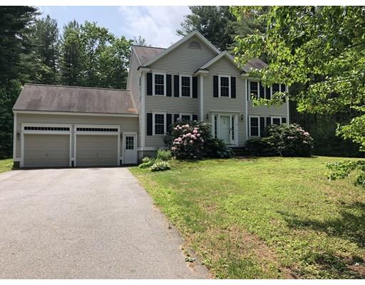 79 Rigby Road Lancaster, MA 01523 - Photo 1 of 23 a front view of house with yard and trees around